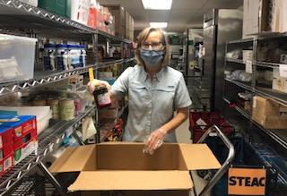 Kim Andrup volunteering at STEAC's food pantry