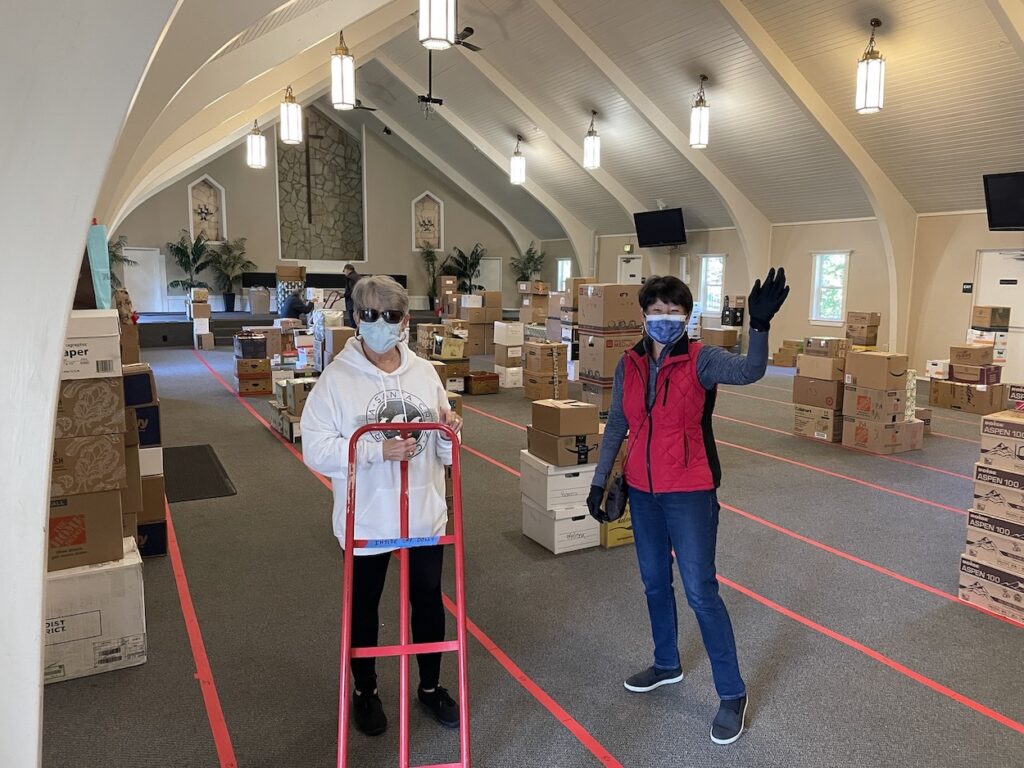 STEAC volunteers sorting gifts inside of a church