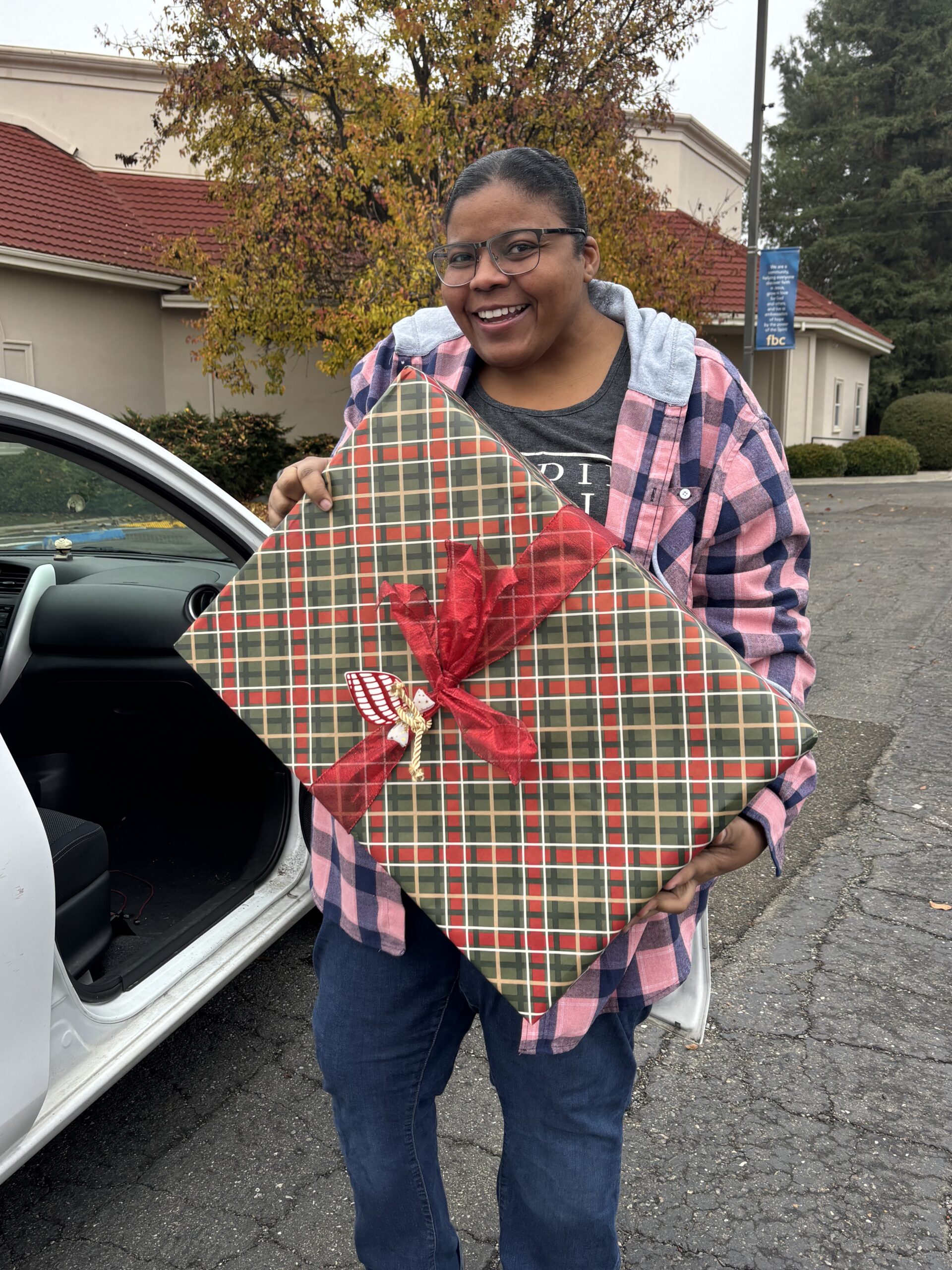 Person holding gift.